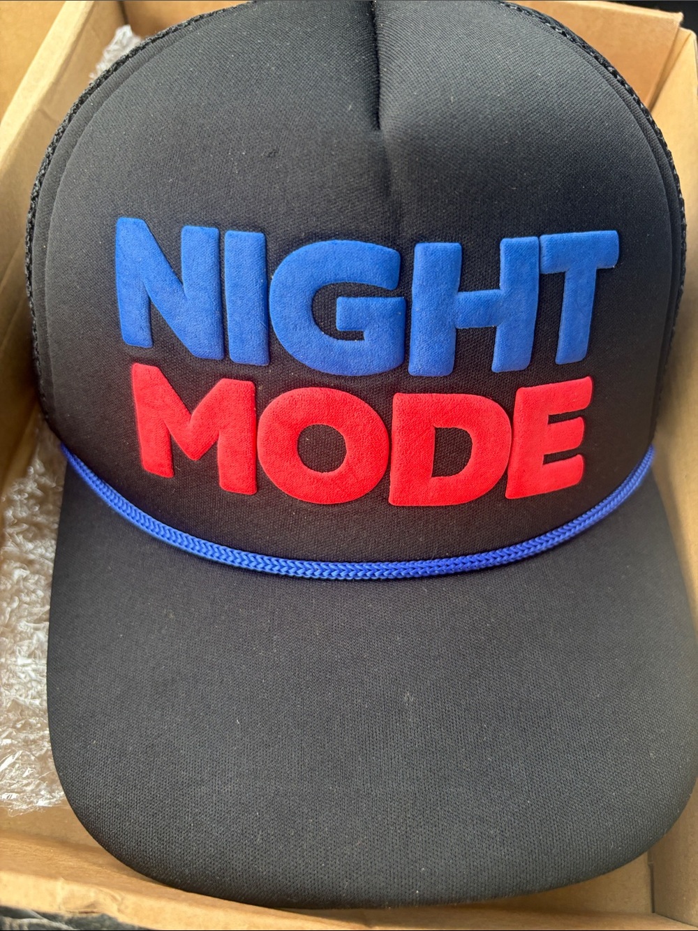 Night Mode Black Trucker Hat - Bold Blue & Red Lettering